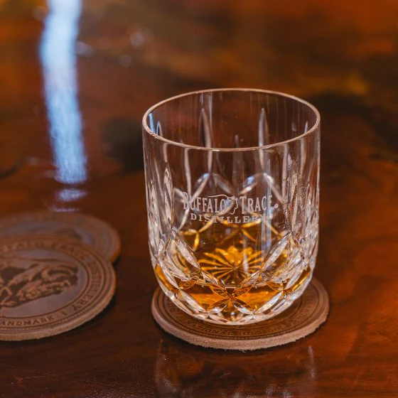 A glass of bourbon showing its deep amber color.